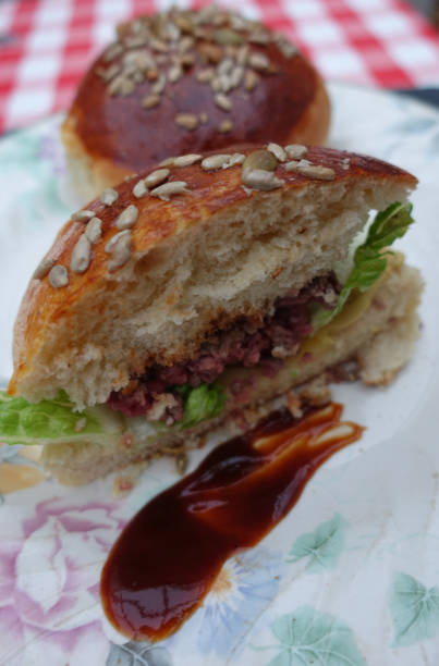 istock Charolais ground beef burger served with ketchup Homemade mixed seed buns 1394348376