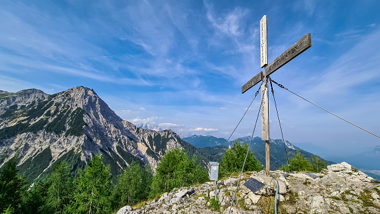 View from summit cross of Ferlacher Spitze on Mittagskogel in the Karawanks, Carinthia, Austria. Borders between Austria, Slovenia, Italy. Rosental valley. Triglav National Park. Hiking adventure