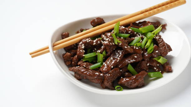 istock Mongolian meat - beef in dark spicy sauce in asian style 1394349678