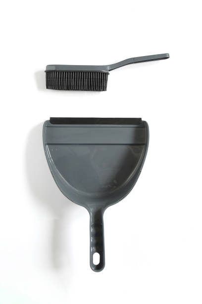 Object, plastic dustpan and silicone brush set in gray and black on white background . Handle item set household chores easier cleaner. stock photo