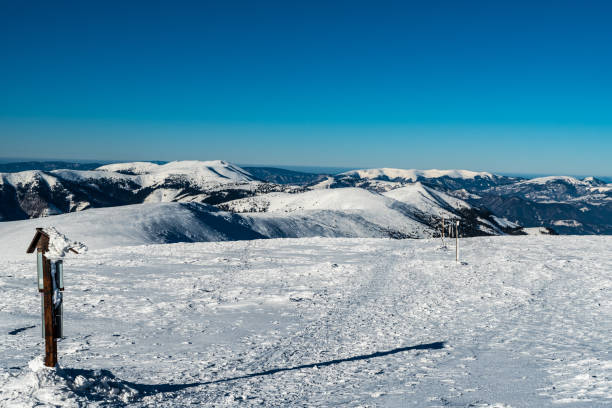 View during hiking to Chabence hill in winter Nizke Tatry mountains in Slovakia Western part of Nizke Tatry mountains and highest part of Velka Fatra mountains from hiking trail bellow Chabenec hill in Nizke Tatry mountains in Slovakia durkova stock pictures, royalty-free photos & images