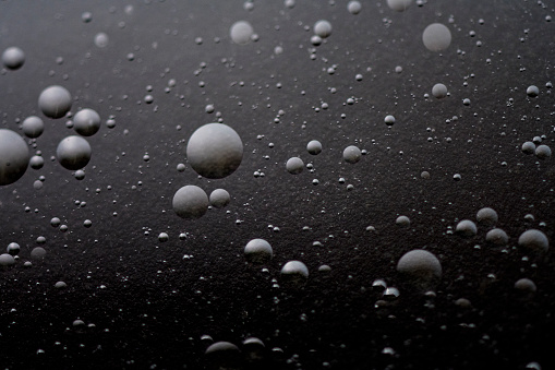 Black abstract background with bubbles. Air bubbles texture.