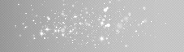 świecący efekt świetlny z dużą ilością błyszczących cząstek izolowanych na przezroczystym tle. - glitter stock illustrations