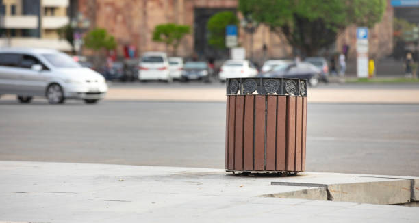 istock Metal trash bin in a city. 1394359585