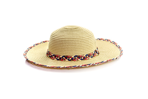 New, elegant, summer, sun-protection, straw hat on a white background close-up
