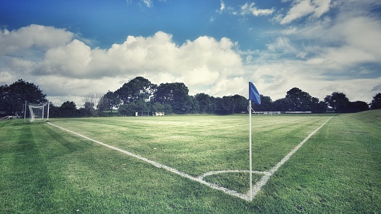 Close-up on a soccer ball hitting the goal net after scoring - scoring a goal concepts