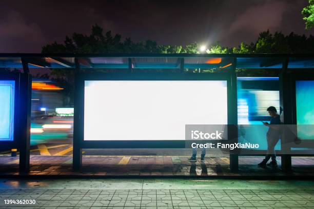 Young Man Waiting For Public Transportation At Rush Hour Bus Stop In Shenzhen China Stock Photo - Download Image Now