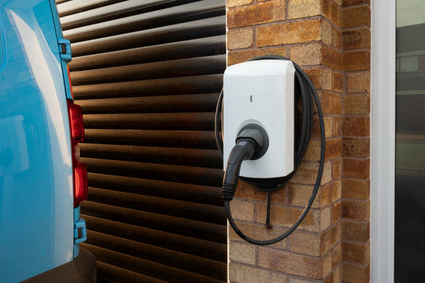 Domestic Electric Vehicle Charging Unit Close up of a type C domestic electric vehicle charging unit installed on the wall of a house garage door opener photos stock pictures, royalty-free photos & images