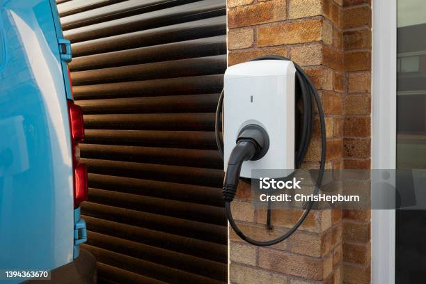 Domestic Electric Vehicle Charging Unit Stock Photo - Download Image Now - Residential Building, Electric Vehicle Charging Station, Electric Car