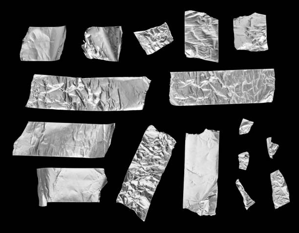 istock Set of different size silver grey adhesive tape isolated on black background. 1394368302