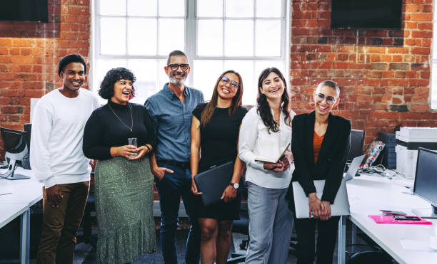 istock Successful businesspeople smiling in an office 1394370888