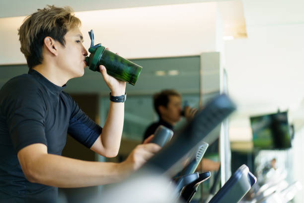 istock Sportsman doing a cardio exercise on elliptical machine. 1394371174