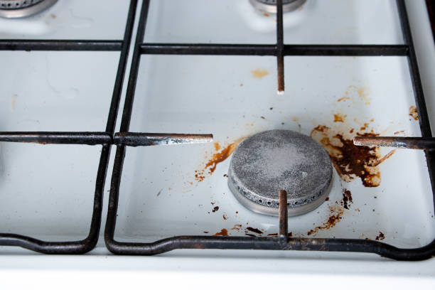 istock Fragment of a dirty kitchen gas stove. 1394371949