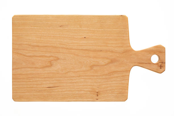 istock cutting board isolated on white background, Stylized handmade cherry wood chopping board 1394372749