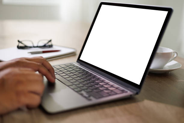 istock mockup blank screen computer man using laptop  on desk in office laptop with blank copy space screen for your advertising text message 1394375786