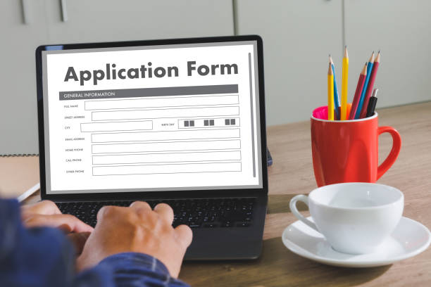 istock business man working on laptop computer use Online Web Job Application Form moniter Personal information 1394375788