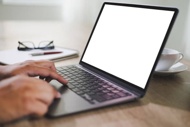 istock mockup blank screen computer man using laptop  on desk in office laptop with blank copy space screen for your advertising text message 1394375794