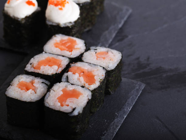 istock Maki rolls with over grey background. Japanese Sushi. close up 1394376036