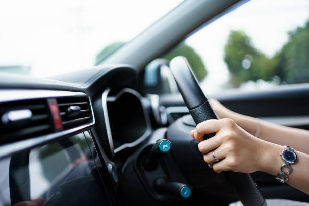 istock Woman driving a car. 1394377146