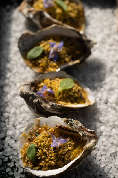 istock Grilled oysters with fried garlic on sea salt 1394378665