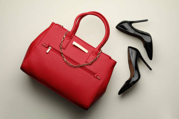 istock Stylish woman's bag and shoes on light background, flat lay 1394379379