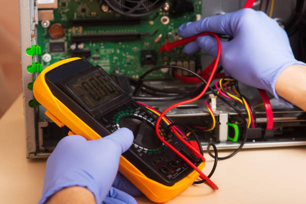 istock Wizard repairs personal computer with tools and hands. Disassembly of the computer into spare parts 1394380689