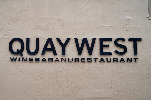 Derry, UK- April 13, 2022: The sign for Quaywest restaurant  in Derry, Northern Ireland