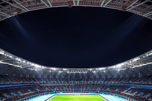 View of sports stadium venue at night, digitally generated composite image