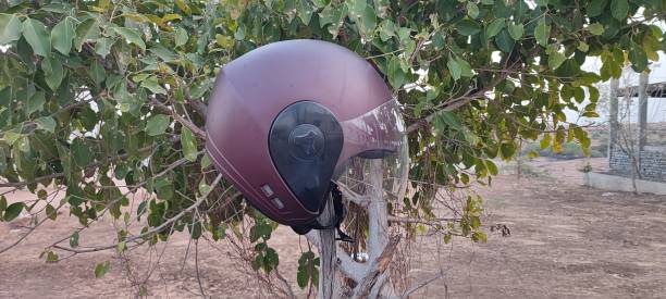 istock Sports sefty helmet on green planet 1394383232