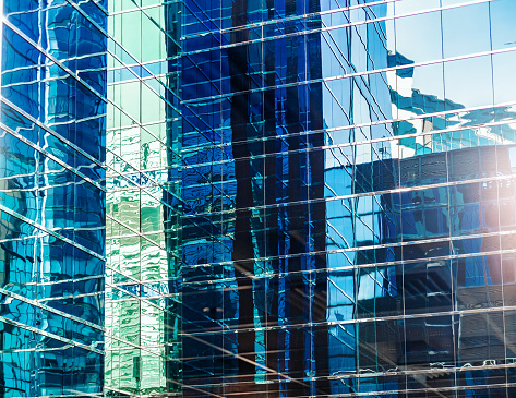 Abstract reflection of business office buildings in glass window in downtown urban area, Hong Kong, China