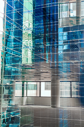 Abstract reflection of empty business office buildings in glass window in downtown urban area, Hong Kong, China