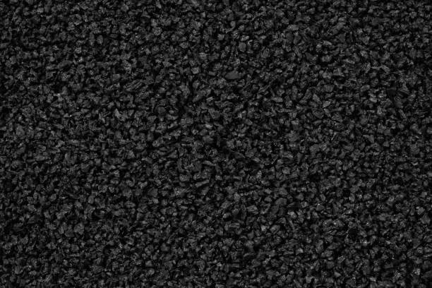 istock Close-up of black plastic polymer granules background 1394385333