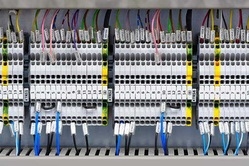 Color wires in a box of distribution of an electricity, PLC Control panel with wiring, lectric control panel enclosure for power and distribution electricity.