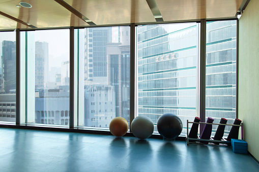 Yoga studio workout area in urban city environment, digital composite