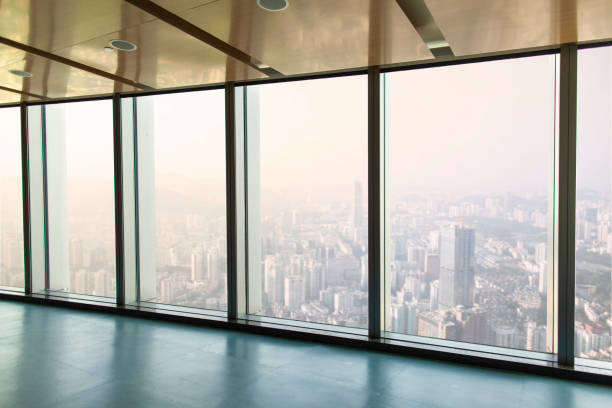 View from office of glass wall windows to urban city stock photo