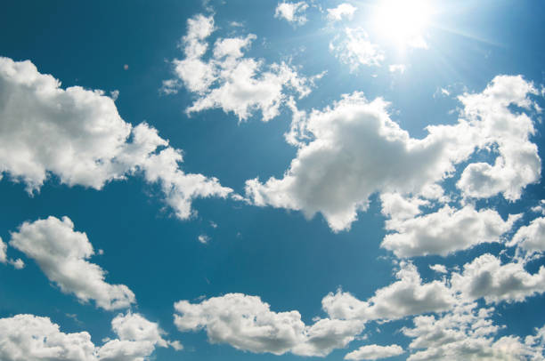 istock Summer cloudscape of large white cumulus clouds 1394387229