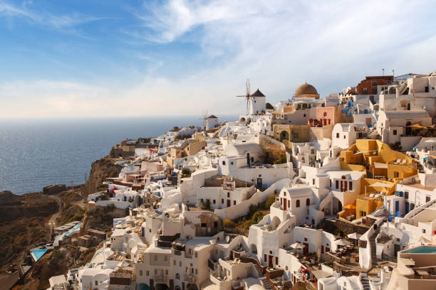 istock Santorini iconic view with Windmill in Oia village 1394388696