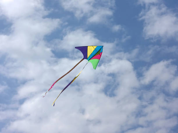 istock Colorful kite floating on the sky 1394390716