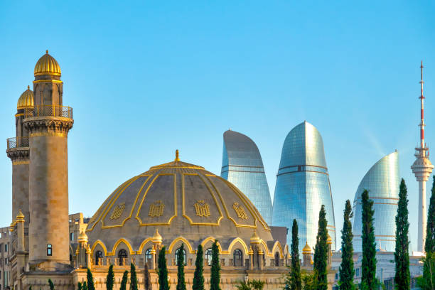 Taza Pir Mosque Taza Pir Mosque and Flame Towers, Baku, Azerbaijan baku stock pictures, royalty-free photos & images