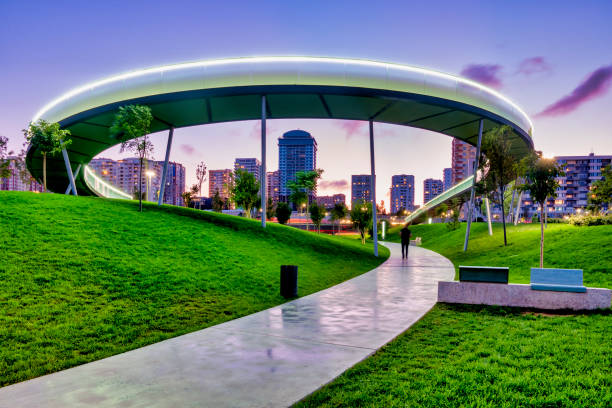 Woman running in Toronto's new Trillium park with city skyline in the background