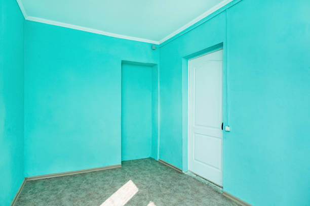 blue painted room with balcony and bed