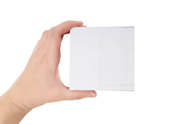 istock Hand holding a stack of business cards isolated 1394396526