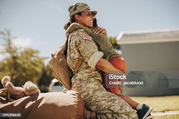 Joyful Military Mom Reuniting With Her Son At Home Stock Photo - Download Image Now - US Veteran's Day, Family, US Military
