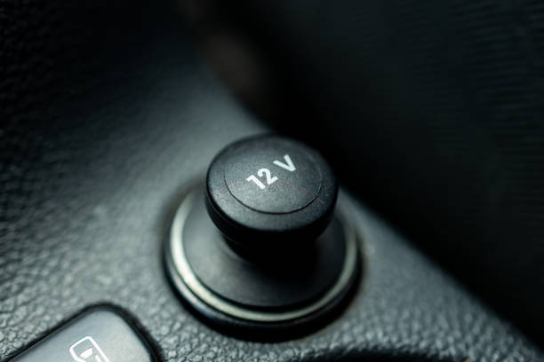 istock car 12v electric socket close up macro. 12 volt auto repair service concept. car charger 1394396708