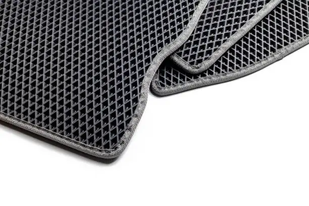 stack of eva ethylene vinyl acetate car floor mats. waterproof honeycombs textured carpet.