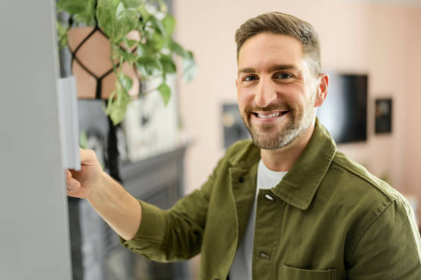 istock nice man set the thermostat at house 1394397797