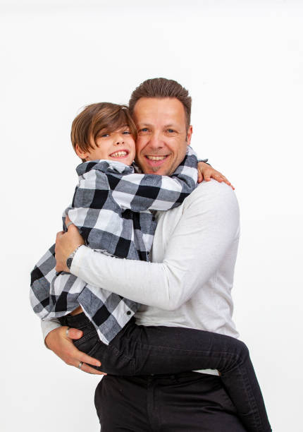 istock Father and son portrait on white background 1394399074