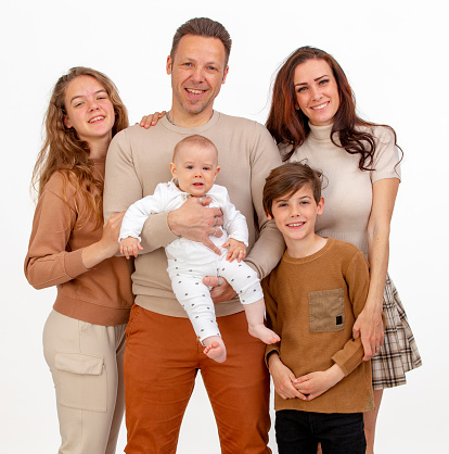 Happy family portrait with three children