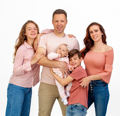 Young happy family portrait with three children
