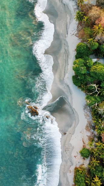 海の航空写真 - モンテスマビーチ、コスタリカ、中央アメリカ - costa rican sunset ストックフォトと画像